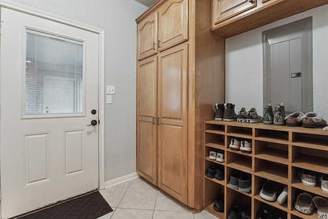 interior space with electric panel and light tile patterned floors