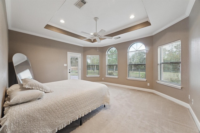 carpeted bedroom with access to exterior, ornamental molding, ceiling fan, and a raised ceiling