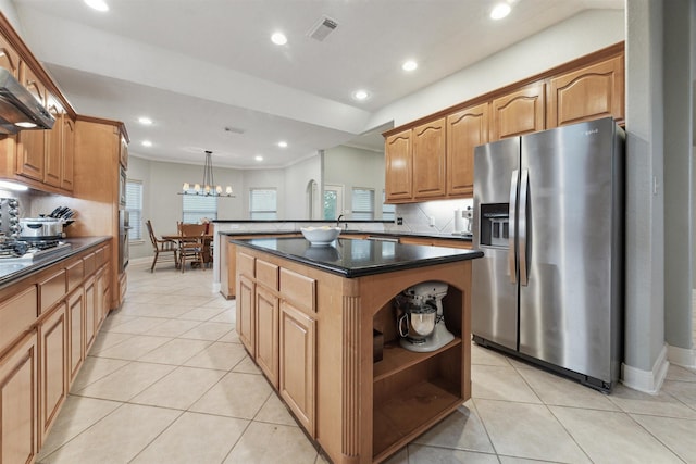 kitchen featuring hanging light fixtures, light tile patterned flooring, a kitchen island, and stainless steel fridge with ice dispenser