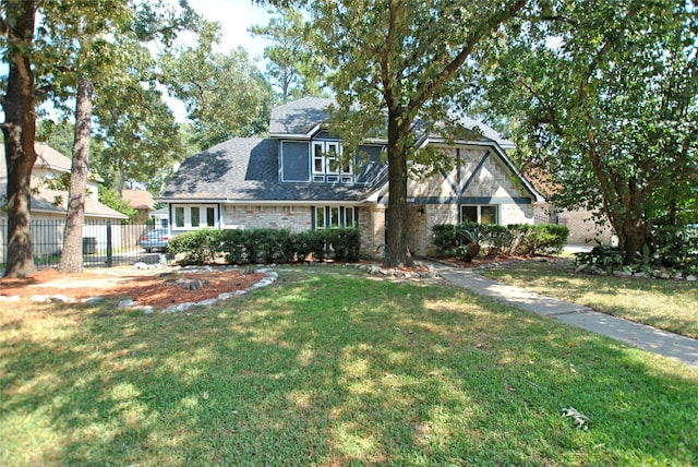 view of front of house featuring a front yard and fence