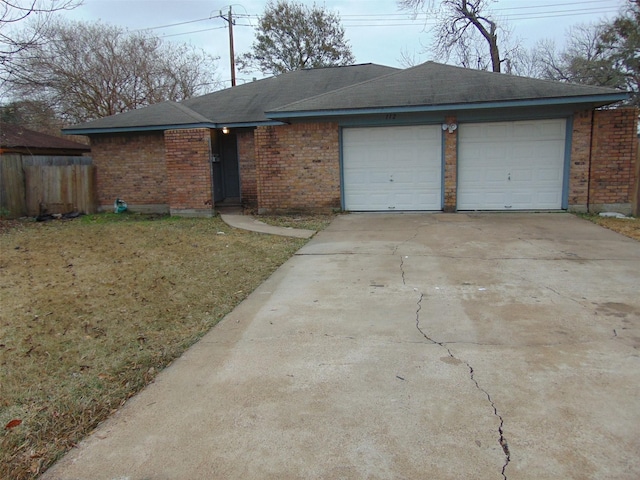 single story home with a front lawn and a garage