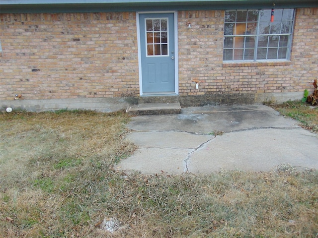 property entrance with a patio