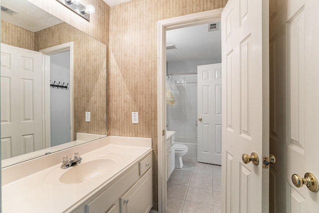 bathroom with visible vents, vanity, toilet, and tile patterned floors