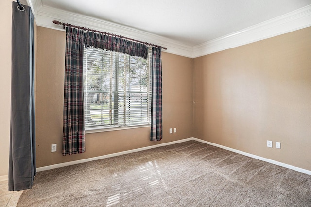 empty room featuring baseboards, carpet flooring, a wealth of natural light, and crown molding