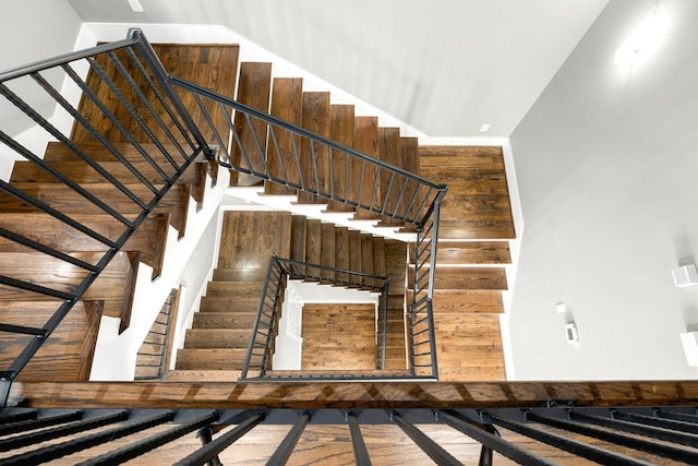 staircase with wooden walls