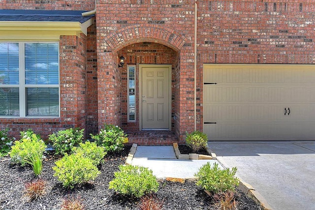 doorway to property featuring a garage