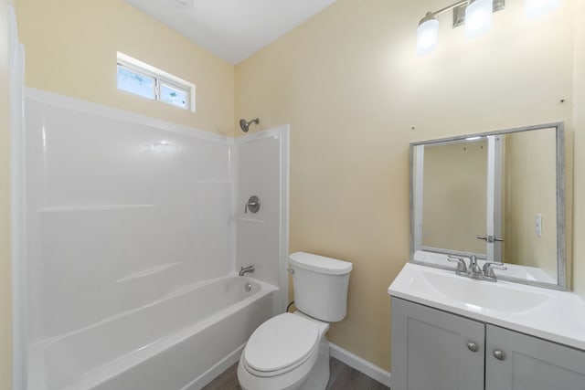 full bathroom with shower / washtub combination, baseboards, vanity, and toilet