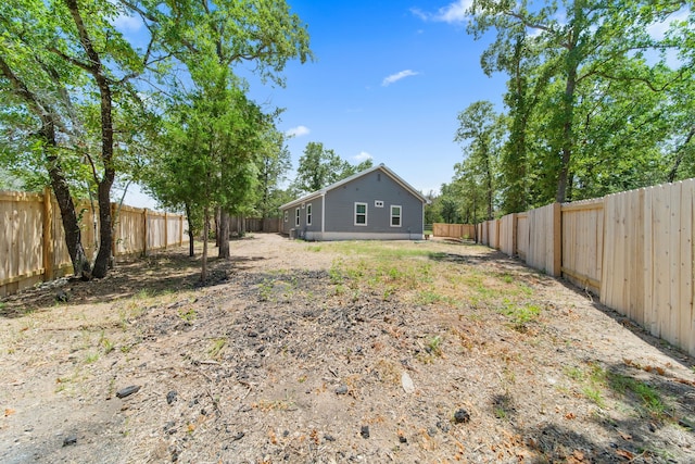 view of yard featuring a fenced backyard