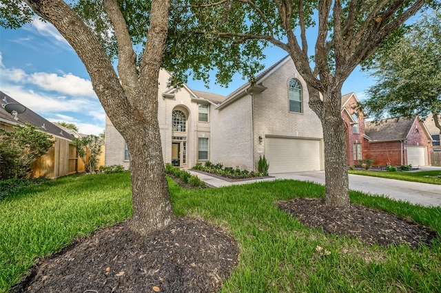 view of front facade with a garage and a front yard