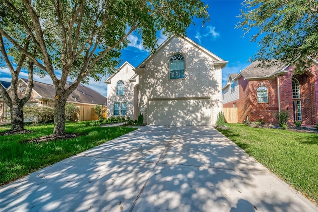 front facade featuring a front yard and a garage