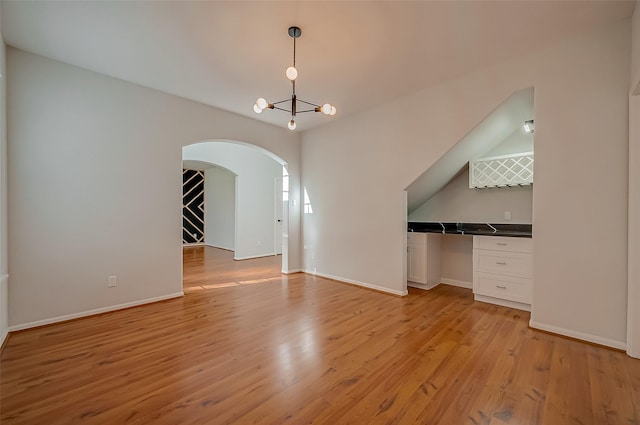 interior space with light hardwood / wood-style flooring and a chandelier