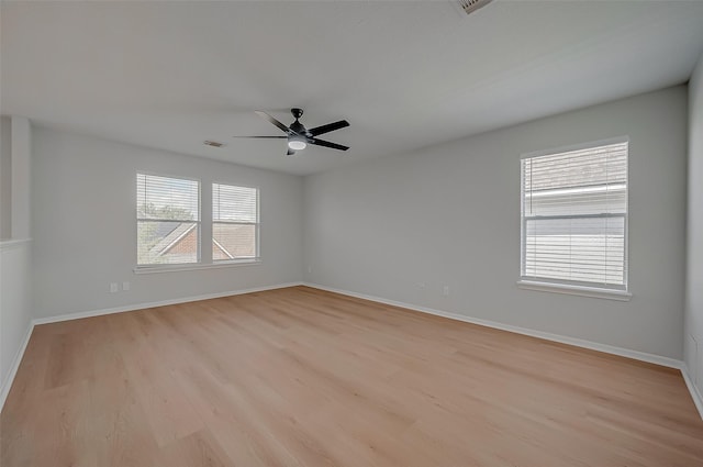 unfurnished room featuring ceiling fan and light hardwood / wood-style floors