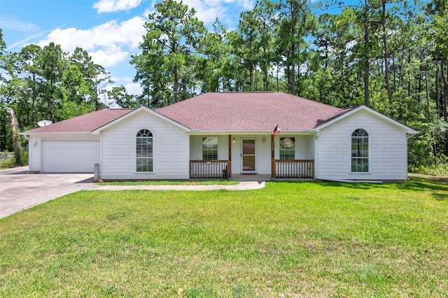 ranch-style house featuring covered porch, a front lawn, and a garage