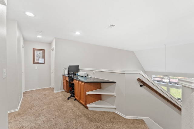 carpeted office space with ceiling fan