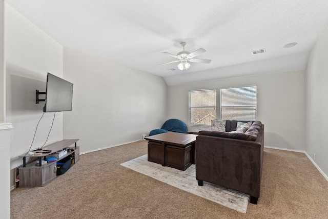 carpeted living room featuring lofted ceiling and ceiling fan