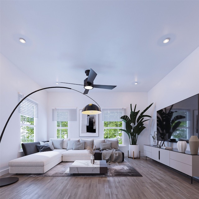 living room with wood finished floors and recessed lighting