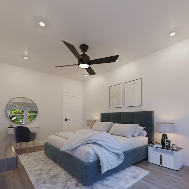 bedroom featuring a ceiling fan, recessed lighting, light wood-style flooring, and baseboards