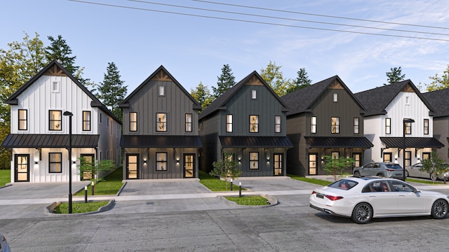 modern farmhouse style home with a standing seam roof, metal roof, board and batten siding, and a residential view