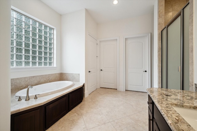 full bathroom with recessed lighting, a stall shower, vanity, a bath, and tile patterned floors