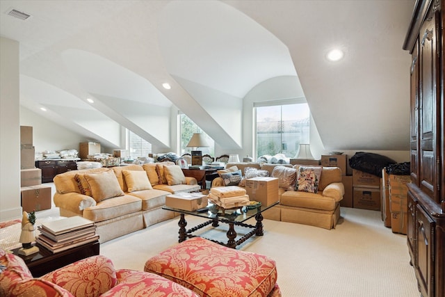 living area with light carpet, visible vents, vaulted ceiling, and recessed lighting