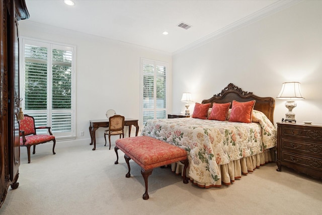 bedroom with ornamental molding, light colored carpet, visible vents, and recessed lighting