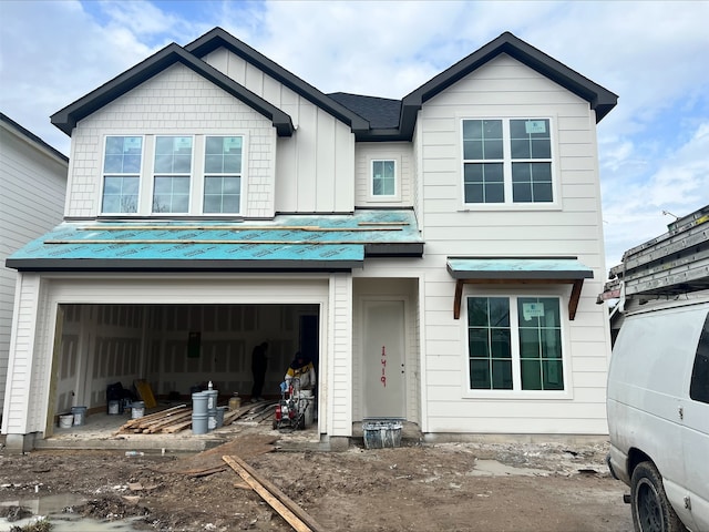 view of front of house with board and batten siding and a garage