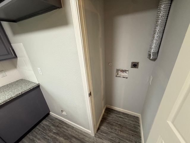 clothes washing area with dark hardwood / wood-style flooring, washer hookup, and hookup for an electric dryer