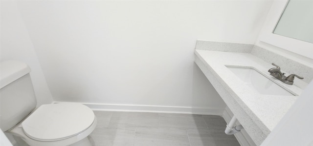 bathroom featuring sink and toilet