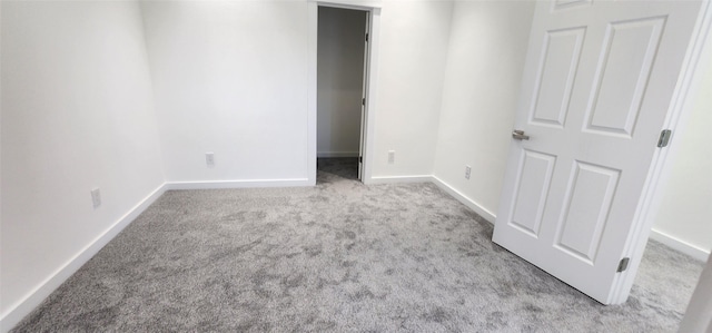 unfurnished bedroom with light colored carpet