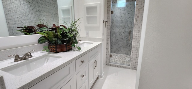 bathroom featuring vanity and a shower with shower door