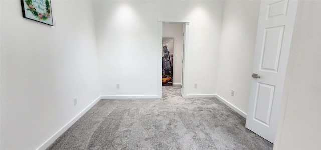 unfurnished room with light carpet