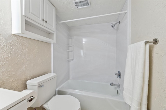 bathroom with a textured ceiling, a textured wall, toilet, and visible vents