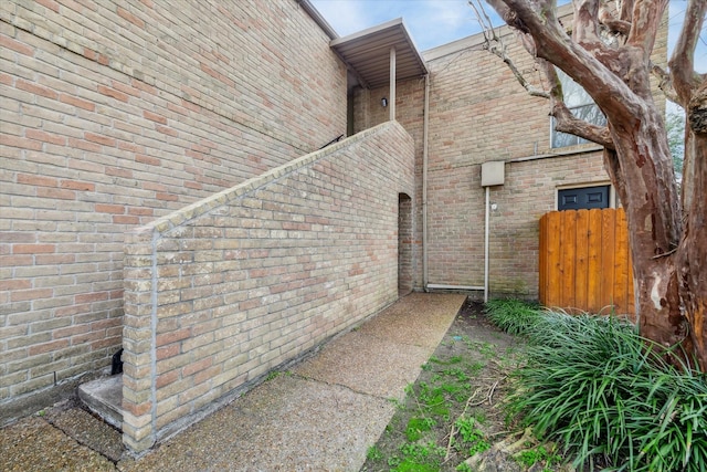 view of side of home featuring brick siding