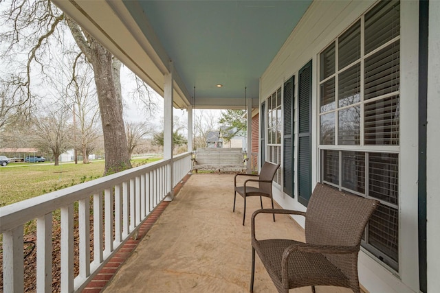 balcony featuring a porch