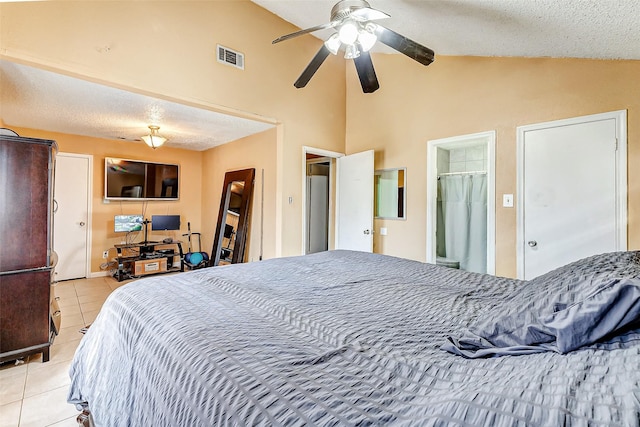 tiled bedroom with lofted ceiling, ceiling fan, and a textured ceiling