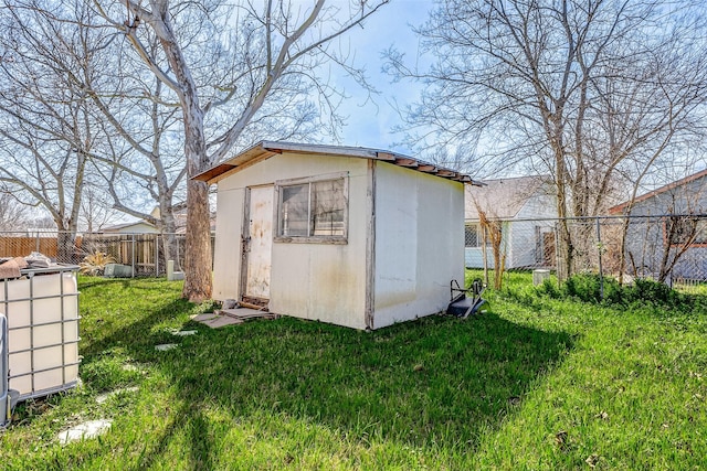 view of outbuilding with a lawn