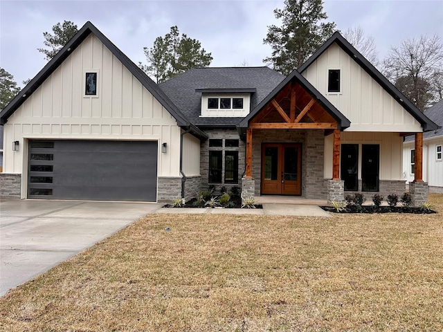 modern inspired farmhouse featuring board and batten siding, stone siding, covered porch, and a shingled roof