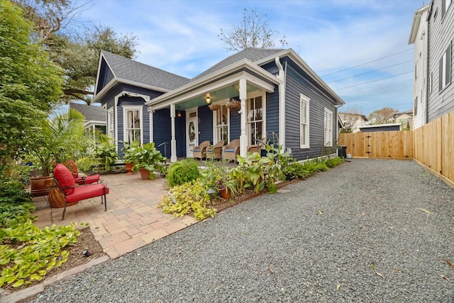 view of front of home with covered porch and a patio area