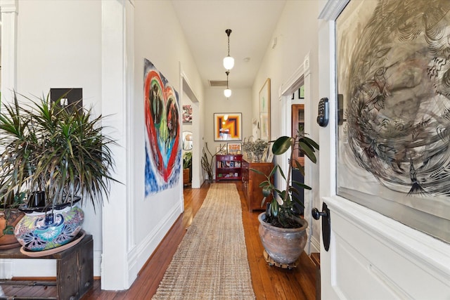 hall with dark hardwood / wood-style flooring