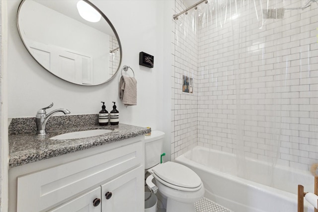 full bathroom with vanity, toilet, and tiled shower / bath