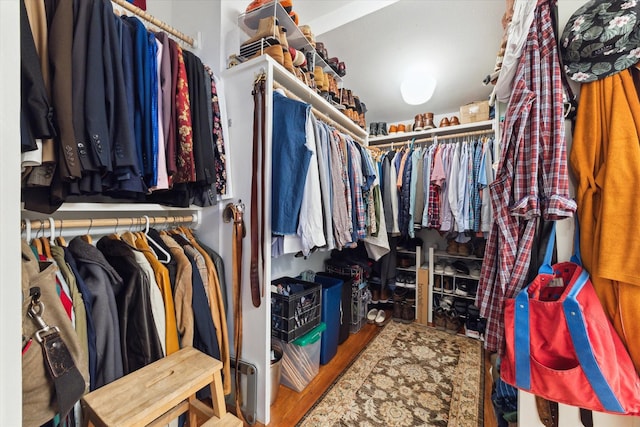 spacious closet featuring hardwood / wood-style floors