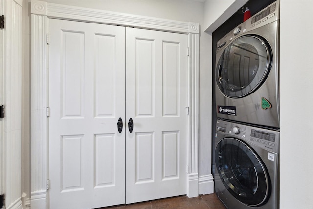 laundry room with stacked washer / dryer