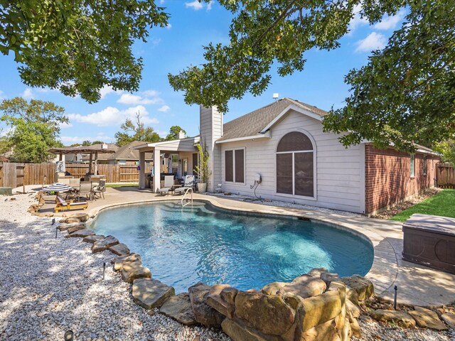 view of pool featuring a patio and a pergola