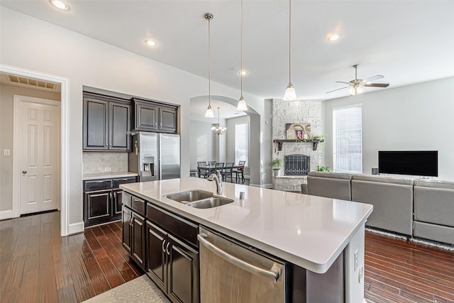 kitchen with stainless steel appliances, light countertops, a sink, and visible vents