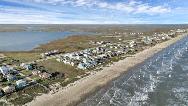 aerial view featuring a water view and a beach view