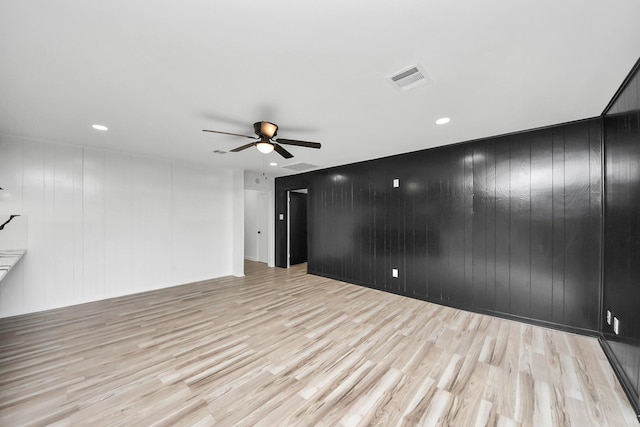 unfurnished room featuring ceiling fan and light hardwood / wood-style floors