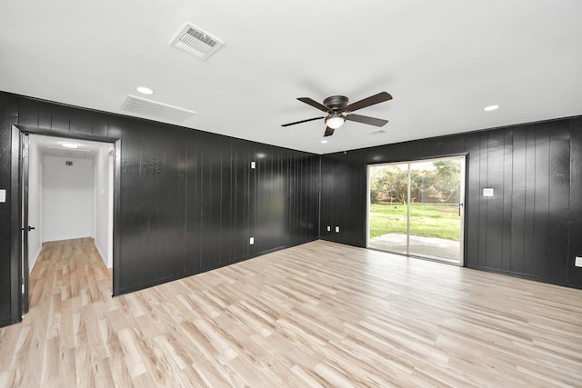 spare room featuring light hardwood / wood-style floors and ceiling fan