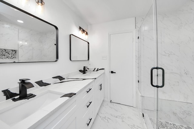 bathroom with vanity and a shower with shower door