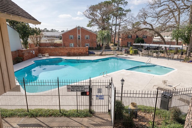 view of pool featuring a patio