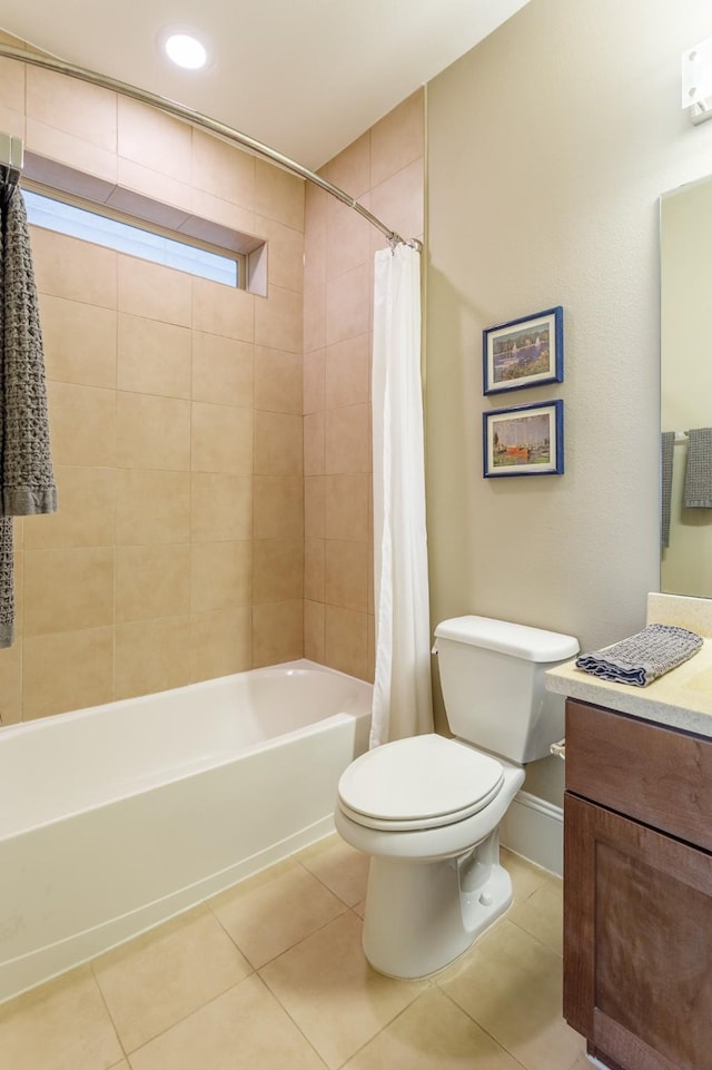 full bathroom with vanity, toilet, tile patterned floors, and shower / bath combo with shower curtain